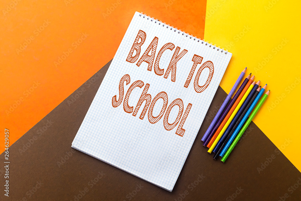 back to school concept, empty notebook and colorful pencil isolated on colorful paper background back to school concept, empty notebook and colorful pencil isolated on colorful paper background