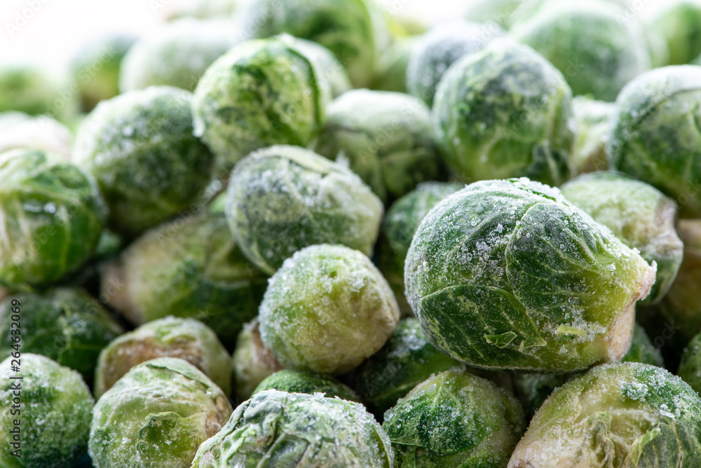 Fototapeta premium A pile of frozen brussels sprouts close up.