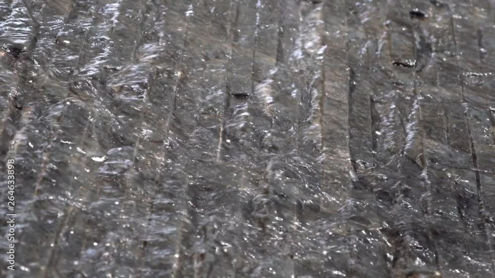 Small waterfall from fountain close up. slow motion. Small waterfall from fountain close up. slow motion.