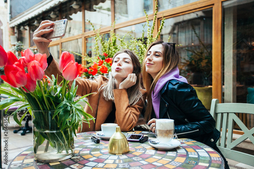 Photography Beautiful girls making selfie in a Parisian cafe
