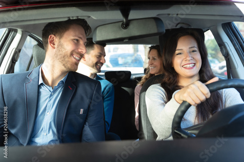 Smiling People Sitting In Car © Andrey Popov