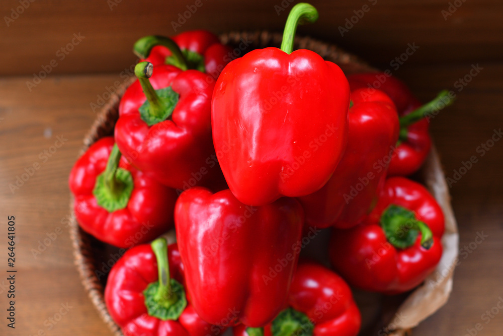 Colourful peppers, red, yellow and green.Their name are bell pepper, sweet pepper or capsicum.Vegetables in a basket, organic food and fresh vegetables. Colourful peppers, red, yellow and green.Their name are bell pepper, sweet pepper or capsicum.Vegetables in a basket, organic food and fresh vegetables.
