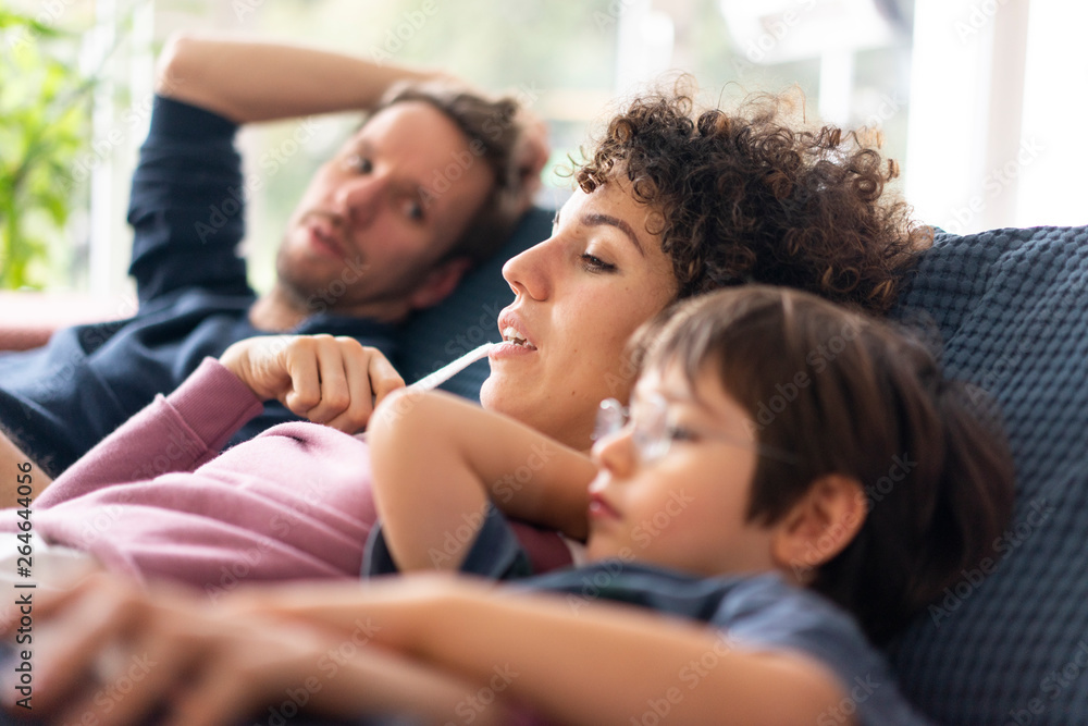Family sitting on couch Family sitting on couch