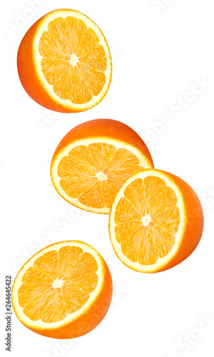 Isolated falling orange fruits pieces. Halves of orange in the air isolated on white background with clipping path 