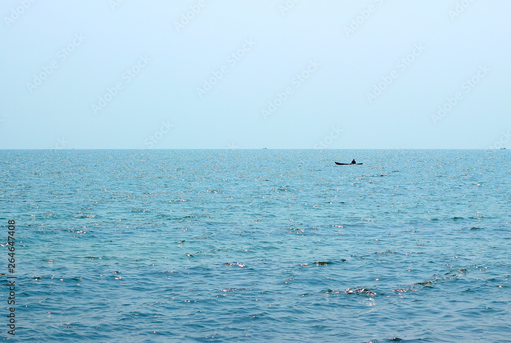 Background of sparkling sea water and light sky