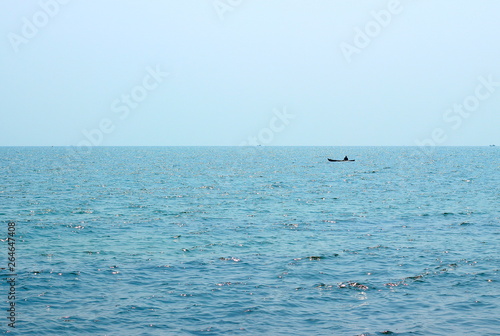 Background of sparkling sea water and light sky