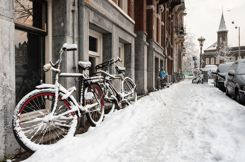 Snow-covered streets in Amsterdam during a cold winter in the Netherlands.