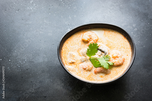 Tom yam kung spicy thai soup with shrimp, seafood, coconut milk and chili pepper. Copy space