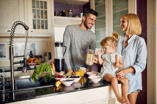 Happy family preparing healthy breakfast