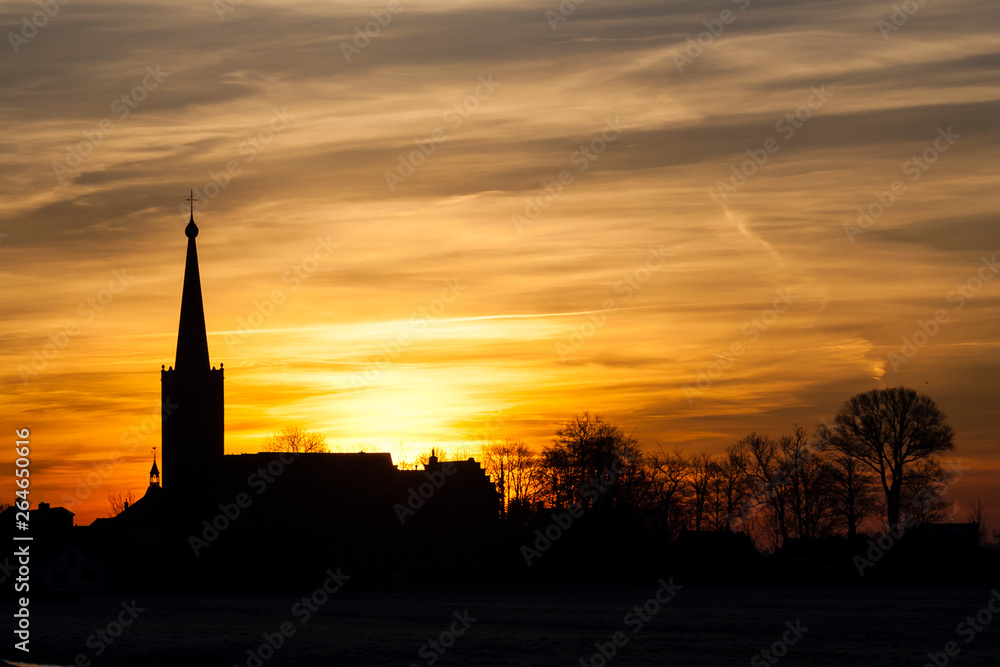 Silhouette of the church of Stompwijk at sunset (Netherlands)