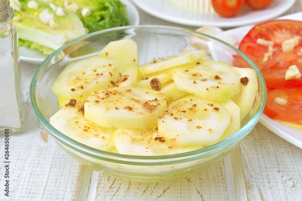 Cucumber salad in glass bowl