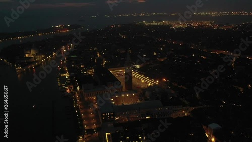 Wallpaper Mural Aerial drone night video of iconic illuminated Saint Mark's square or Piazza San Marco featuring Doge's Palace, Basilica and Campanile, Venice, Italy Torontodigital.ca