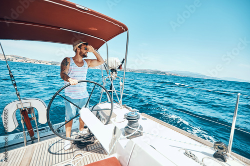 Happy man on a yacht enjoy on vacation. © luckybusiness