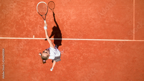 Top view of sportswoman in jump on tennis court