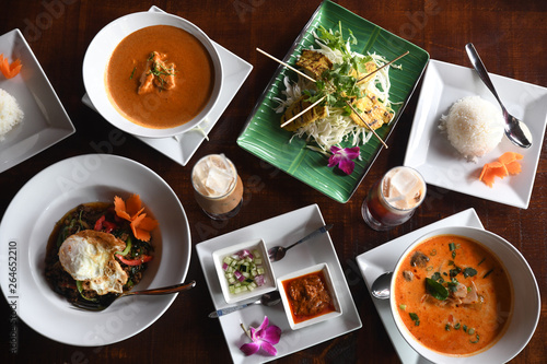 Overhead view of colorful soups and salad with rice photo