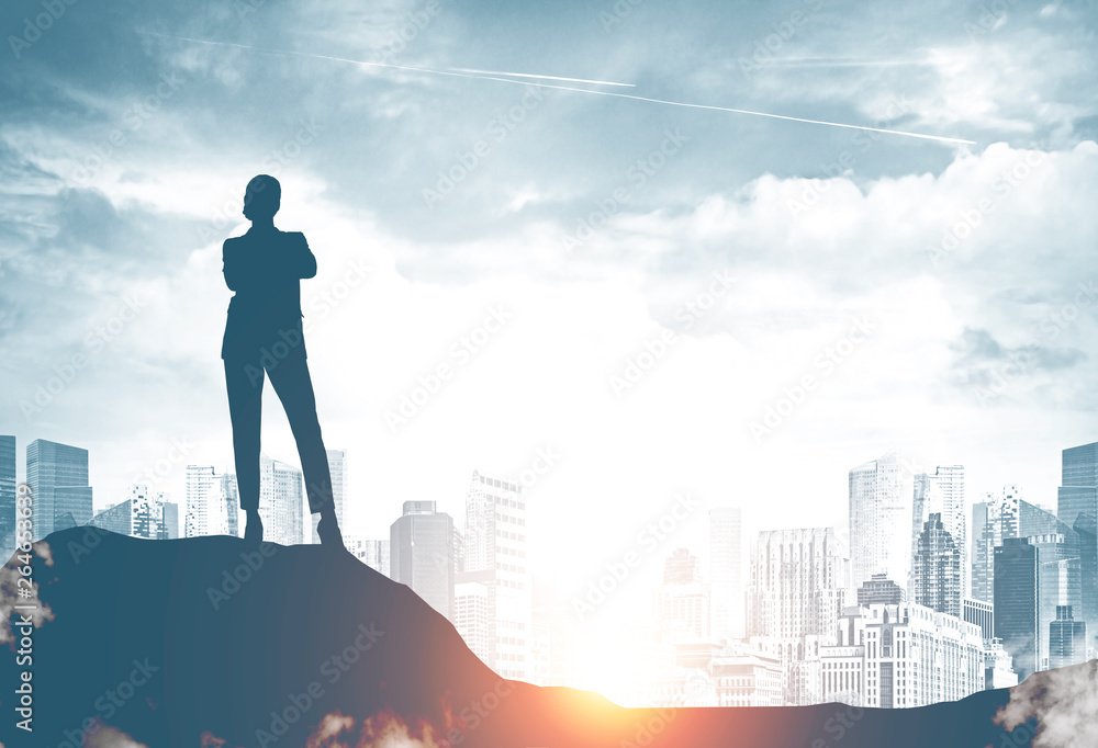 Confident businesswoman silhouette in city Confident businesswoman silhouette in city
