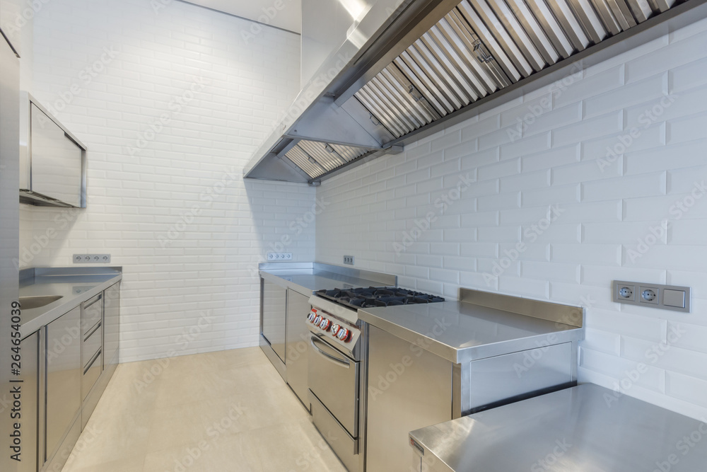 Interior of professional kitchen. Work tables, sinks, cupboards Interior of professional kitchen. Work tables, sinks, cupboards