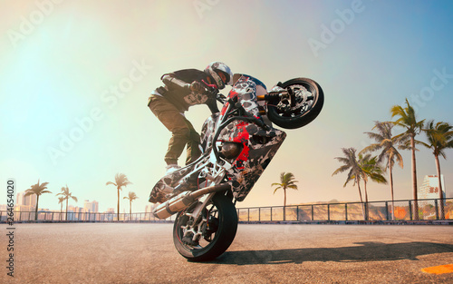Photos Moto rider making a stunt on his motorbike