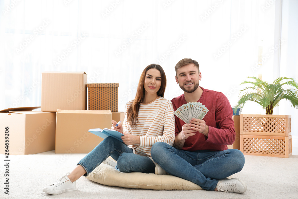 Beautiful young couple with money at home Beautiful young couple with money at home