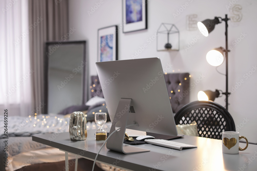 Stylish workplace interior with modern computer on desk Stylish workplace interior with modern computer on desk