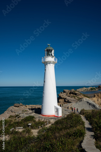 Castlepoint Lighthouse in the Wairarapa, New Zealand on a clear sunny day