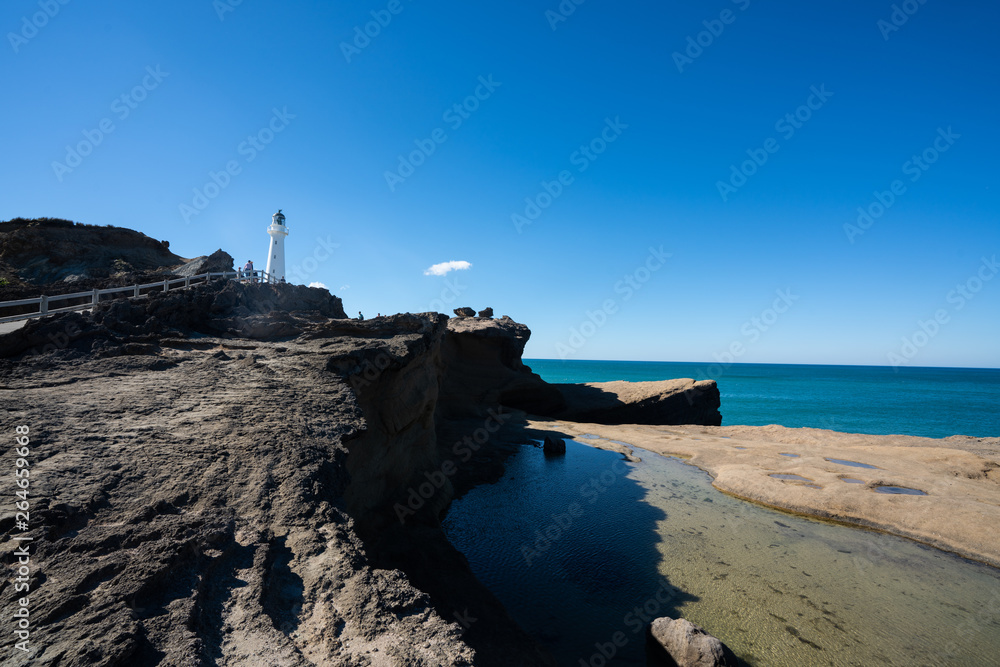 Castlepoint Lighthouse in the Wairarapa, New Zealand on a clear sunny day Castlepoint Lighthouse in the Wairarapa, New Zealand on a clear sunny day