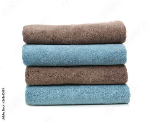 Stack of clean folded towels on white background