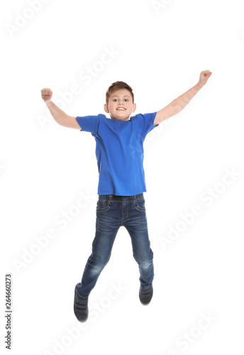Portrait of boy jumping on white background