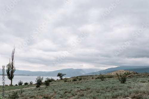View opening onto the Chirkei reservoir from the shore. Mountains in the background of the cloudy sky. Sulak Canyon  Dagestan