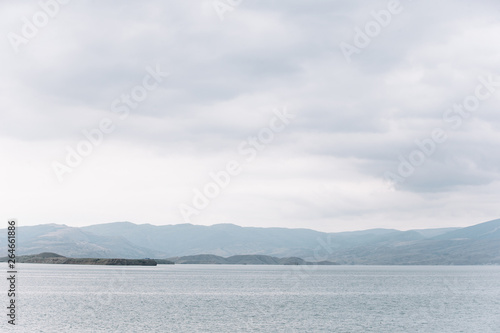 View opening onto the Chirkei reservoir from the shore. Mountains in the background of the cloudy sky. Sulak Canyon  Dagestan