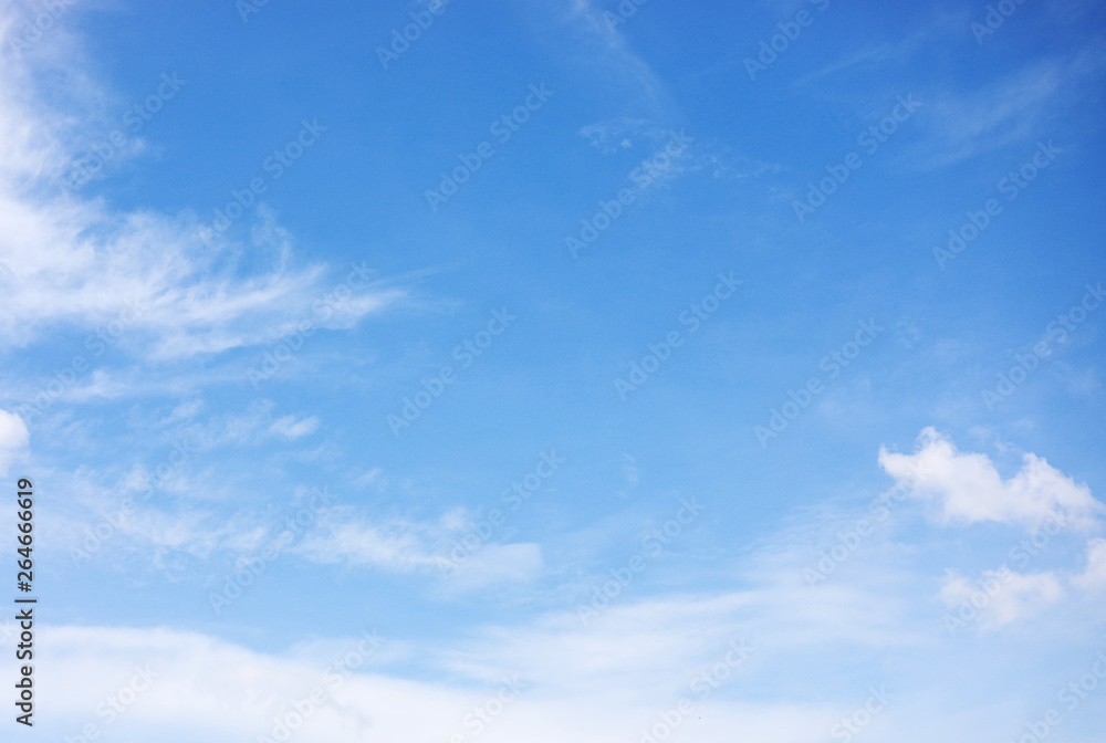 Blue sky background and white clouds soft focus, and copy space