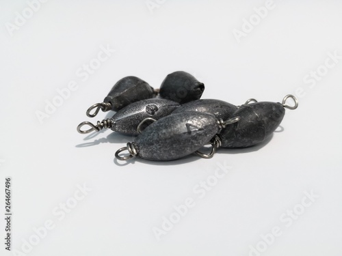 Closeup and macro shot of weighted fishing equipment with white background. 