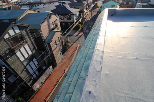 Fototapeta 夕暮れ時のマンションの屋上防水