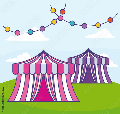 circus tents with garlands in grass