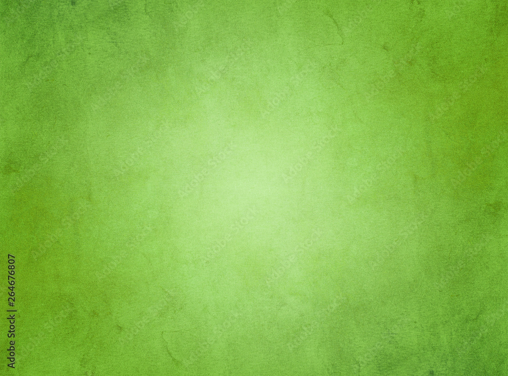 An elegant, rich green, grunge parchment texture background with glowing center. 