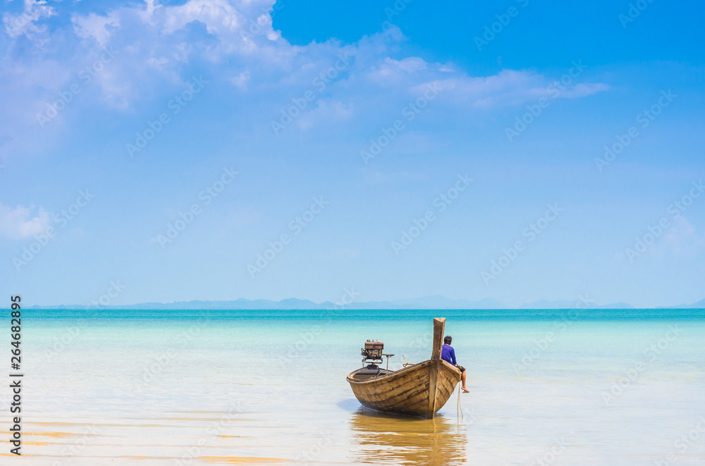 Thai traditional wooden longtail boat and beautiful sand beach , railay Beach railay , Krabi Thailand is located in the zone of the National Park, the Nopparat Thara Beach
