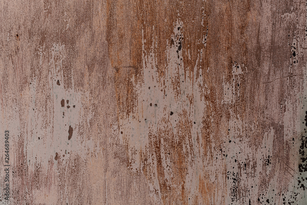 Background from an old iron leaf with the ragged burned out in the sun painted surface Background from an old iron leaf with the ragged burned out in the sun painted surface