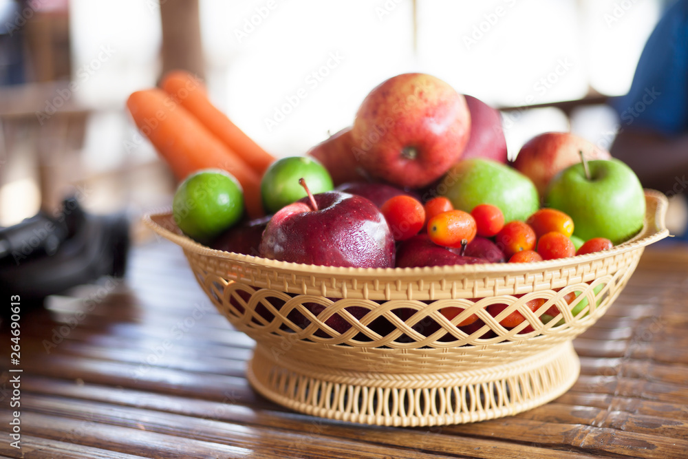 Fresh fruits and vegetables on wooden table.