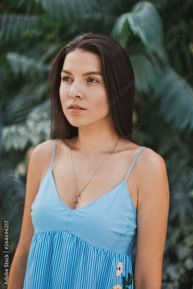 Portrait of young and beautiful woman with perfect smooth skin in tropical leaves. Portrait of young and beautiful woman with perfect smooth skin in tropical leaves.