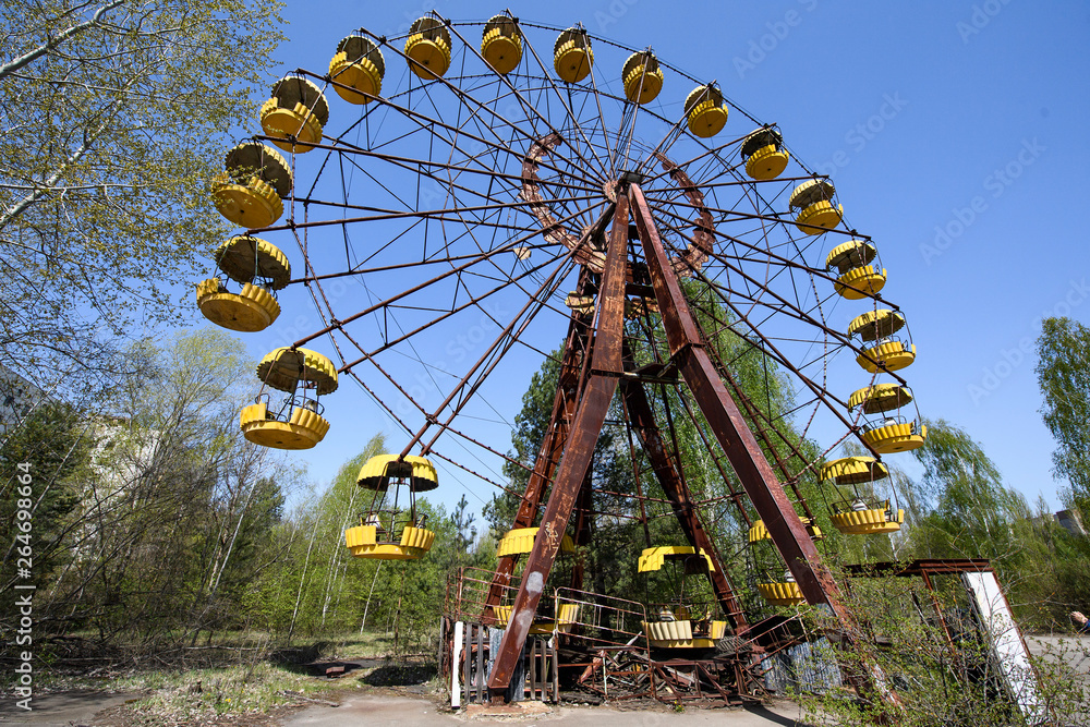 Abandoned amusement park in the city center of Prypiat in Chornobyl exclusion zone. Radioactive zone in Pripyat city - abandoned ghost town. Chernobyl history of catastrophe. April 2019 Abandoned amusement park in the city center of Prypiat in Chornobyl exclusion zone. Radioactive zone in Pripyat city - abandoned ghost town. Chernobyl history of catastrophe. April 2019