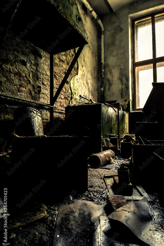 Interior of the old, ruined factory with studio light.