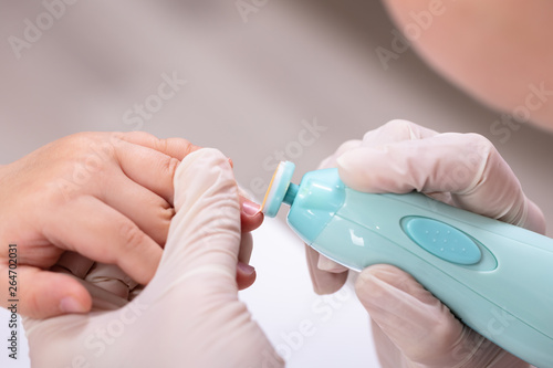 Mother Cutting Her Baby Finger Nail