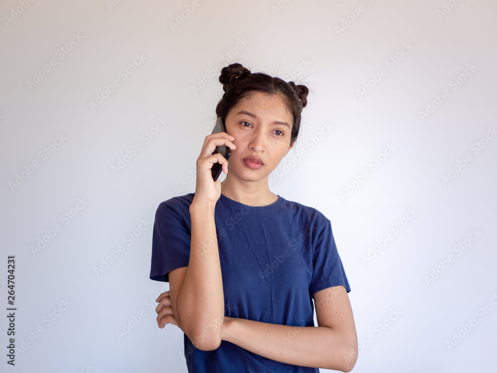 Young asia woman calling with cell telephone over white background Young asia woman calling with cell telephone over white background