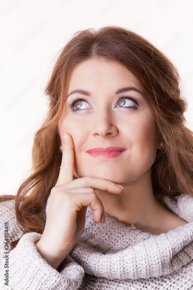 Confused young woman in sweater