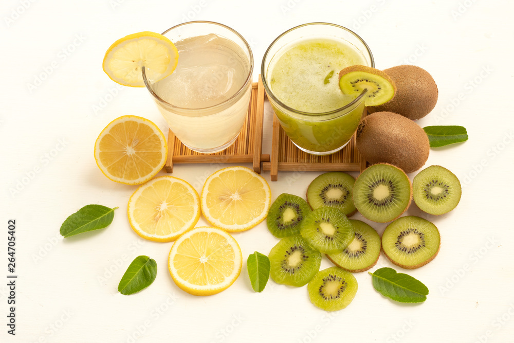 glass of lemon juice with lime and kiwi juice on white background glass of lemon juice with lime and kiwi juice on white background