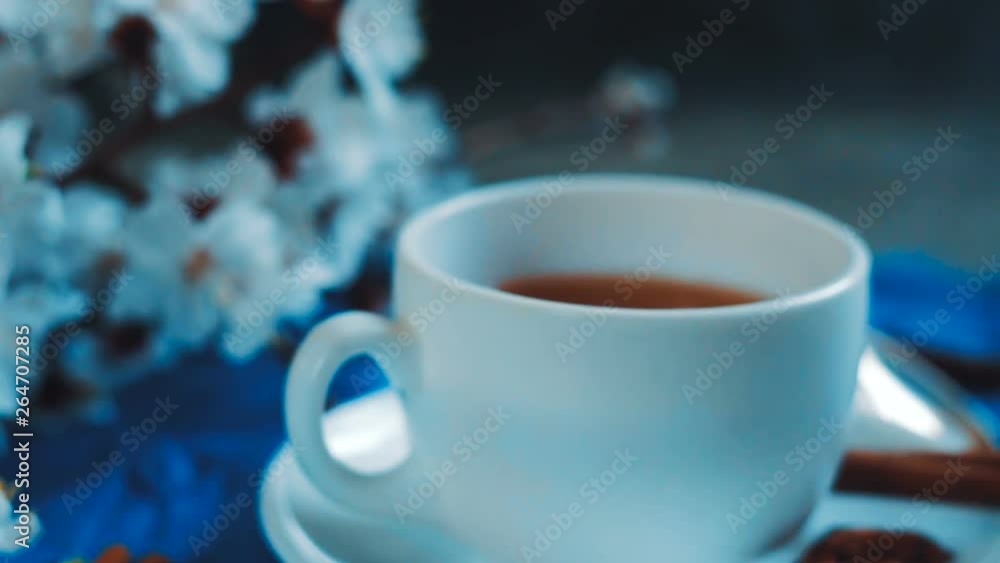 Apricot flowers and tea cup. Spring atmosphere. Apricot flowers and tea cup. Spring atmosphere.