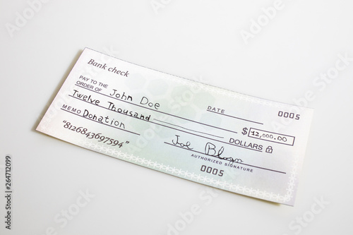 A bank check for donation isolated in a white background