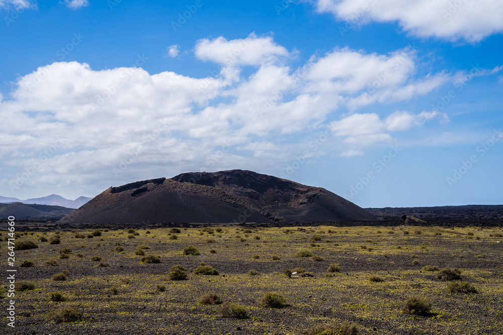 Spain, Lanzarote, Majestic volcano el cuervo in arid caldera nature landscape