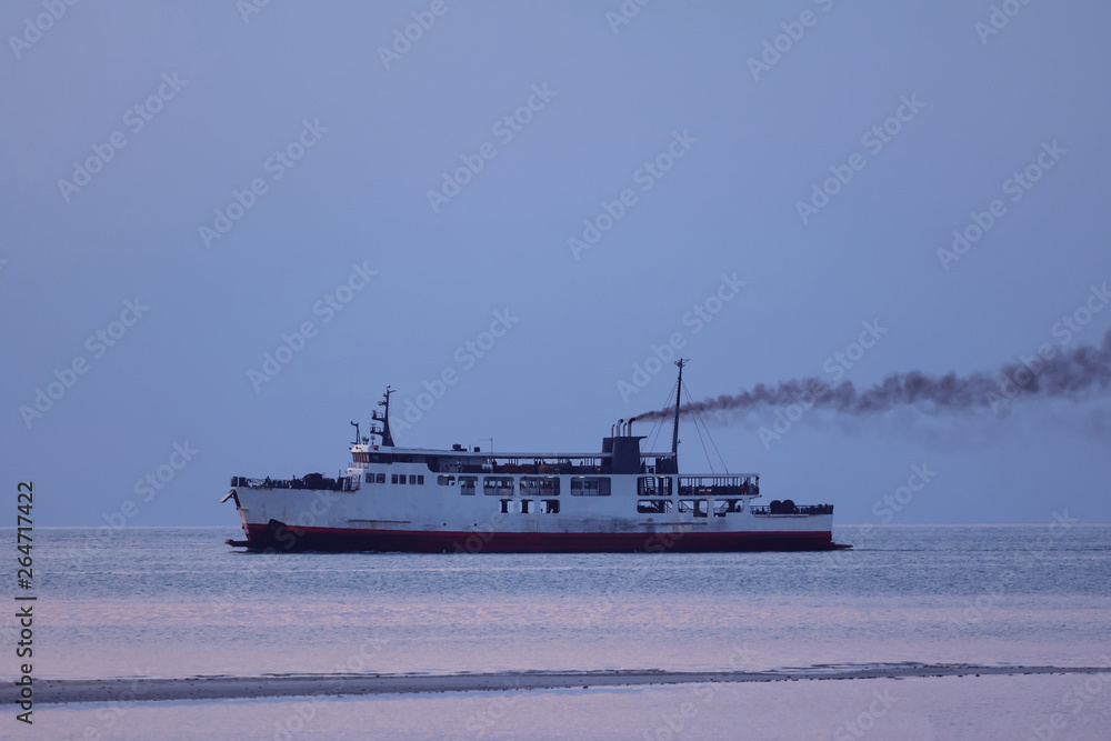 Obraz premium Ferry with smoke coming from stack ,Diesel engine ready to leaving from the harbor