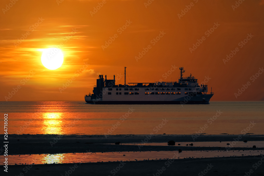 Fototapeta premium The ferry sailing at sea episode sunset